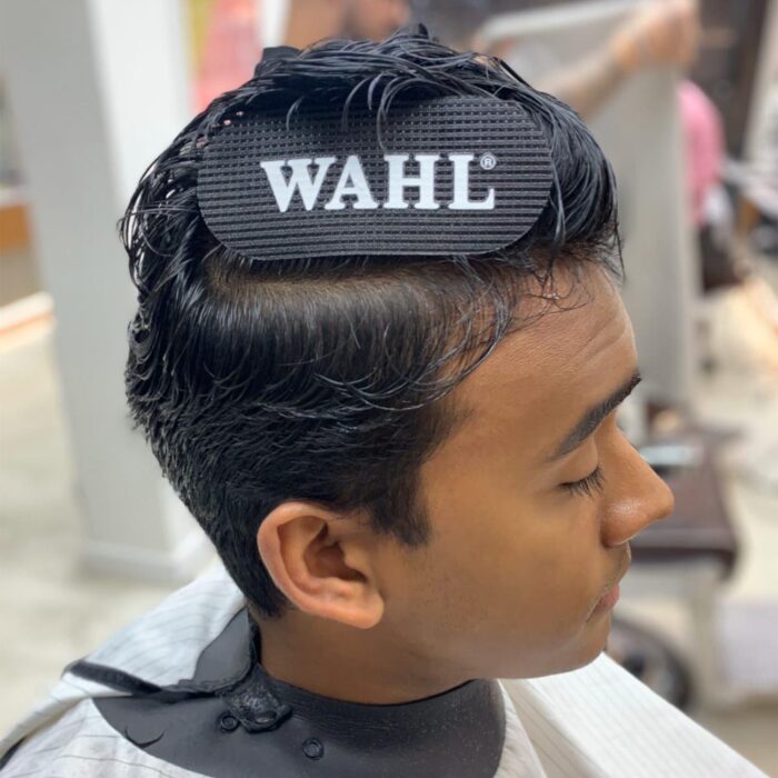 Wahl Black Hair Sectioning Grip on Client